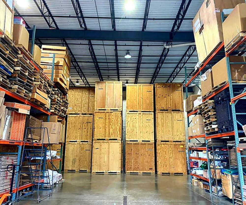 Inside Breda Moving Company's storage warehouse with wooden storage vaults